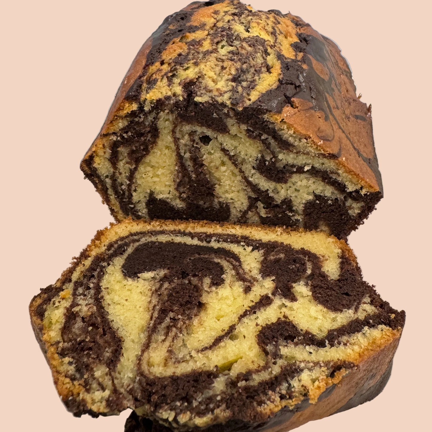 Marble cake with chocolate and vanilla swirled layers on a white plate.