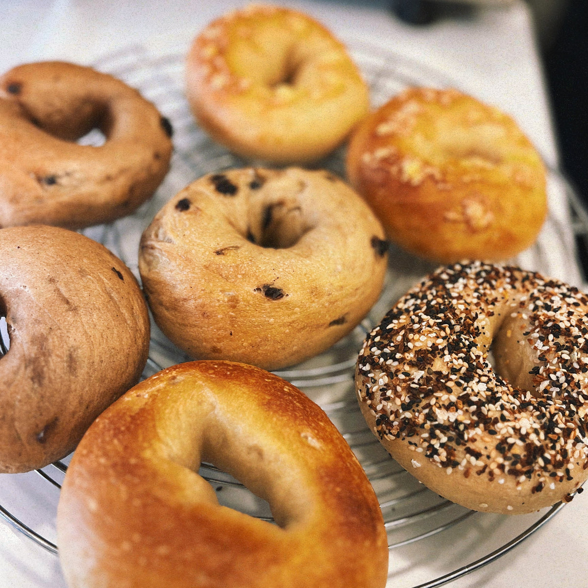 Six assorted bagels of various toppings from cafeAtaraxia in Parede, Portugal. The best bagels in Portugal.
