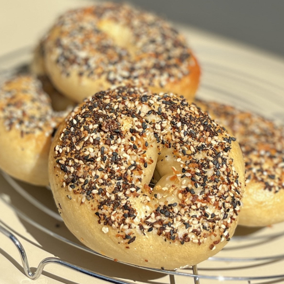 Everything bagels topped with mixed seeds and seasonings at cafeAtaraxia in Parede. The best bagels in Portugal.