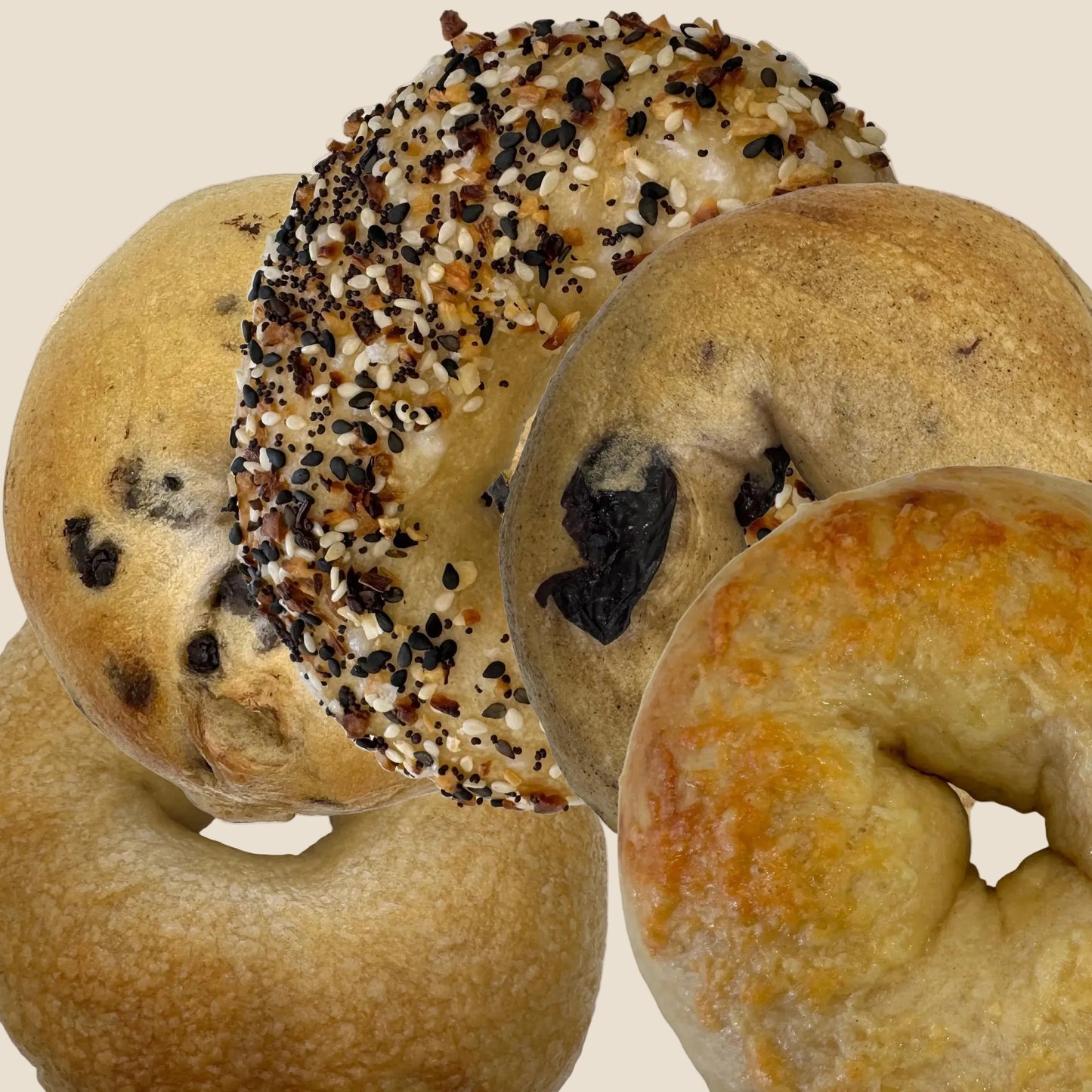 Assorted bagels including plain, sesame, and everything bagels. Customize your housemade cafeAtaraxia bagels.